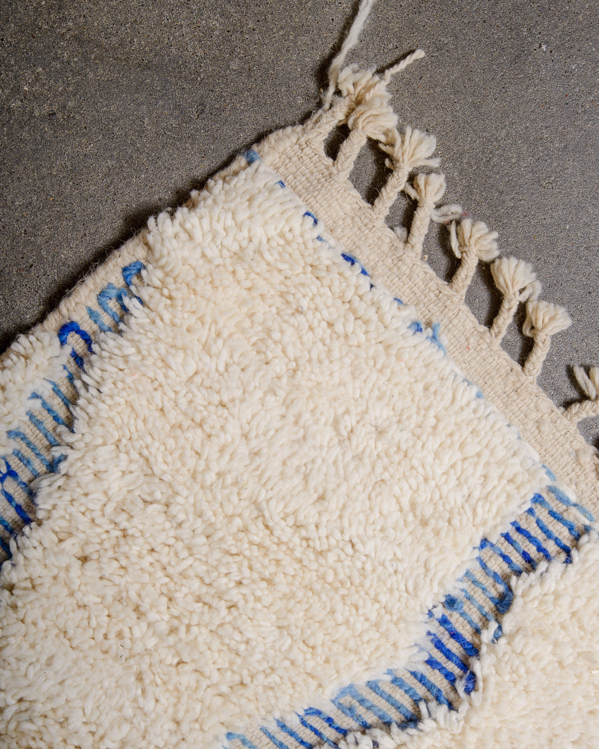 Modern, designer, handcrafted Berber rug from Morocco. Beniourain carpet with minimalist design, natural wool pile and a fluffy texture.